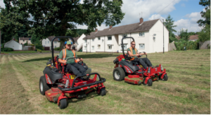 men on mowers