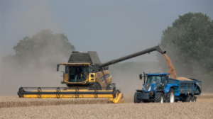 combine harvester and tractor