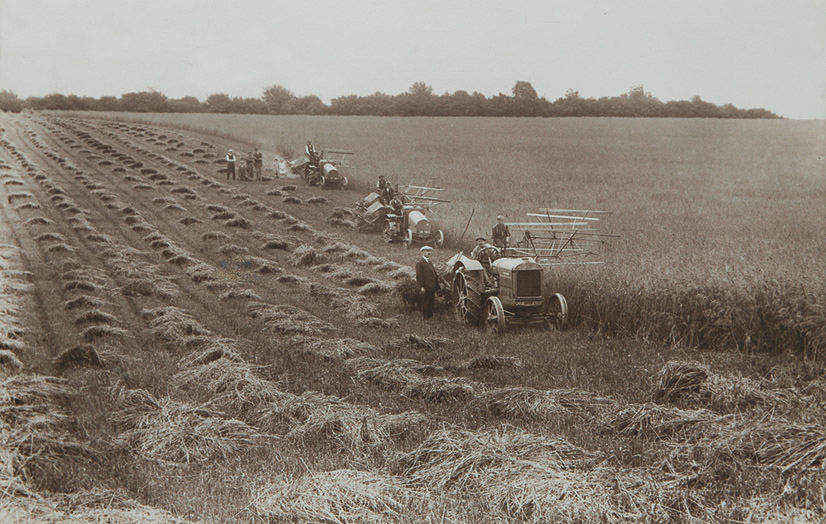 Early tractors in field