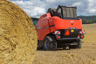 Compact baler with muscle