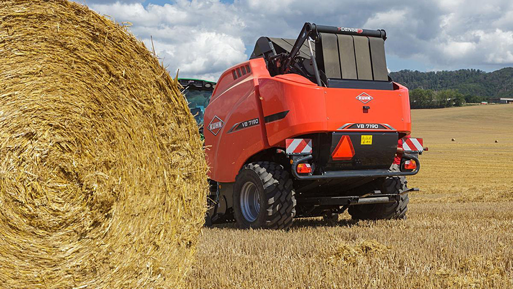 Compact baler with muscle