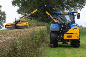 McConnel Power Arm 55-series on New Holland Tractor from Rear