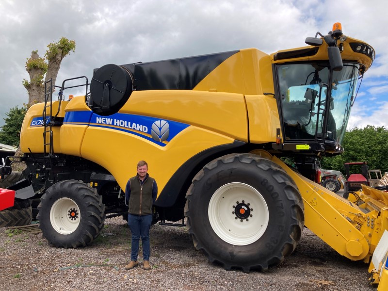 Tom Downes-Hopkins with New Holland Combine
