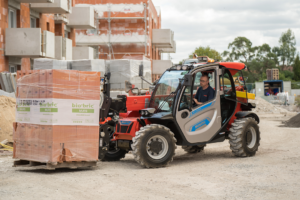 Manitou MT625e electric telehandler moving bricks