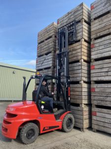 Manitou forklift loading wooden pallets 